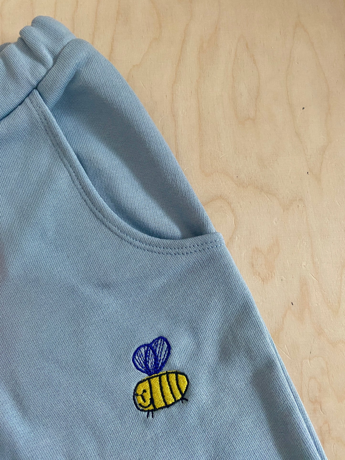 BEE ON LIGHT BLUE PANTS